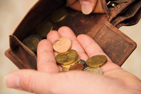 A handful of small moneyの写真素材