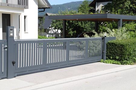 A new house with a metal sliding gate