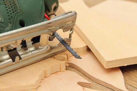 A jigsaw with sawn wood