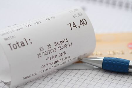 A bill with money in a restaurantの写真素材