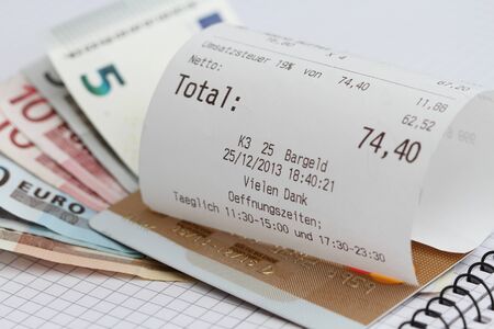 A bill with money in a restaurantの写真素材