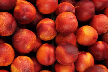Many peaches in a marketの写真素材