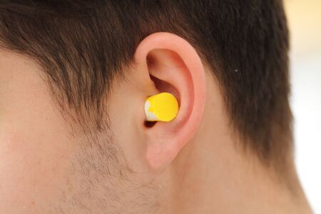 A man is wearing a hearing protectionの写真素材