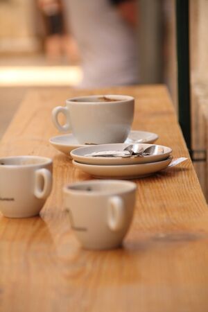 Empty coffee cups in a street cafeの写真素材