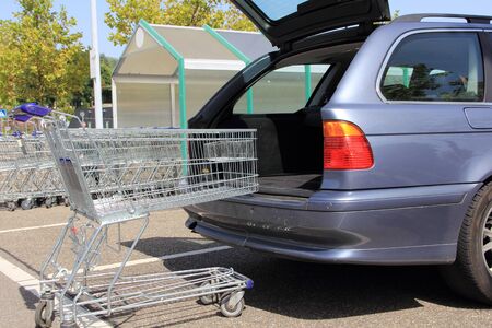 A car with empty shopping carts