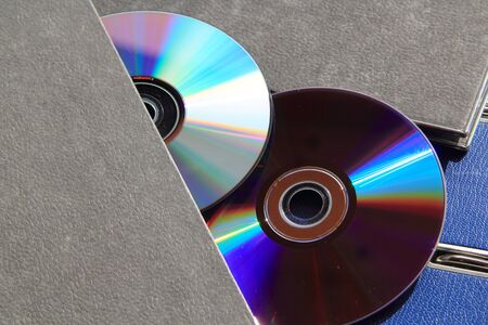 A folder with DVD in a blank notepad