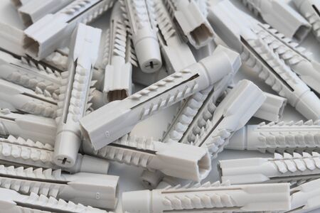 Many colorful different plastic dowels