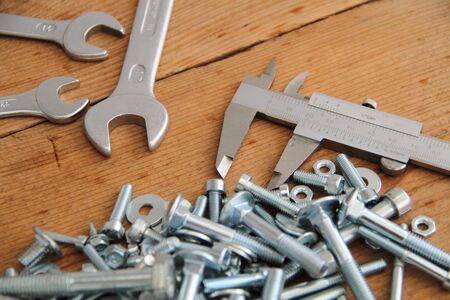 Bolts and nuts on a workbench