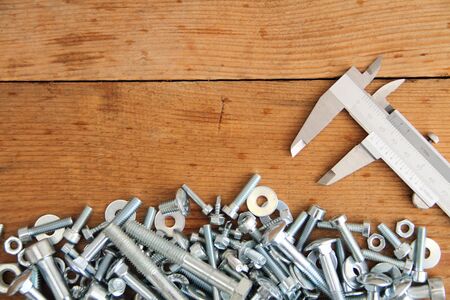Bolts and nuts on a workbenchの写真素材
