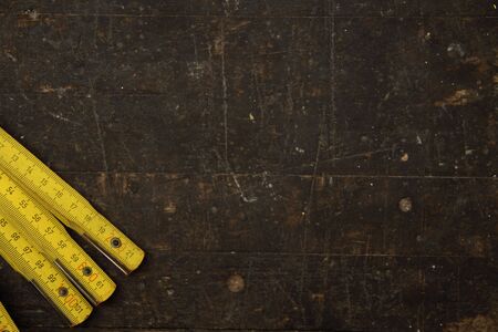 A workbench with a folding rule as a background
