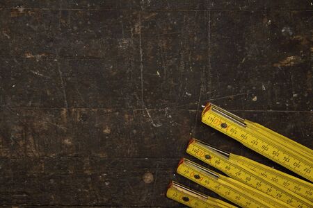 A workbench with a folding rule as a background