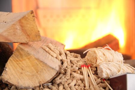Wood pellets with fire in the background