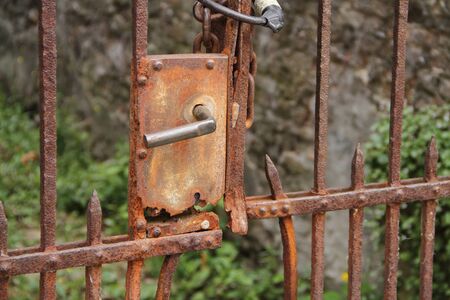 An old rusted garden gateの写真素材