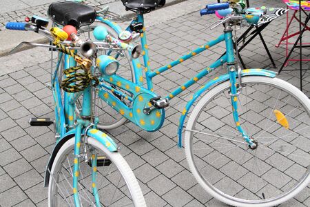Two blue old bicycles in the cityの写真素材