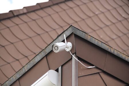 Security camera on a house wall