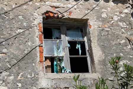 Old broken lattice windows in a house