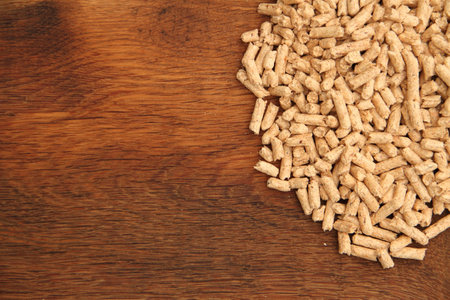 an old oak board with wood pelletsの写真素材