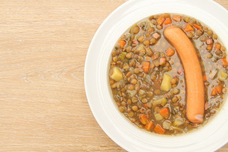 delicious freshly made lentil soup with a sausageの写真素材