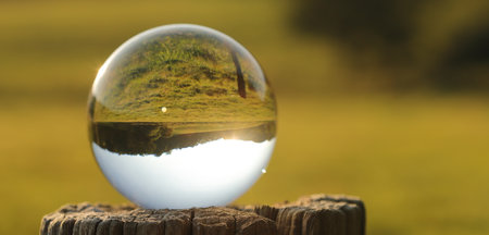 a beautiful landscape photographed through a lens ball