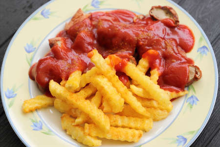 delicious sausage with french fries and curry sauceの写真素材