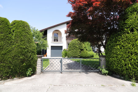 a new house with a driveway gate