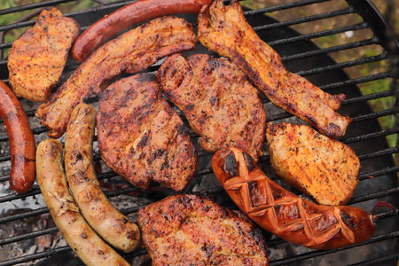 Various meat and sausages on the charcoal grill