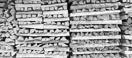 stacked dry firewood as a backgroundの写真素材