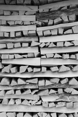 stacked dry firewood as a backgroundの写真素材
