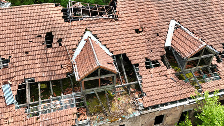 an old collapsed tiled roof as an aerial photographの写真素材