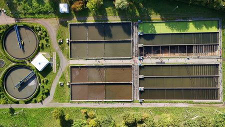 Aerial View of a Modern Wastewater Treatment Plant with Circular and Rectangular Clarifier Tanks