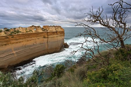 Rock formations at coastline, Great Ocean Road, Australiaの写真素材