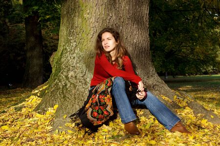 Young woman in autumn parkの写真素材