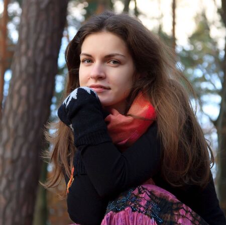 Portrait of young woman in autumn parkの写真素材