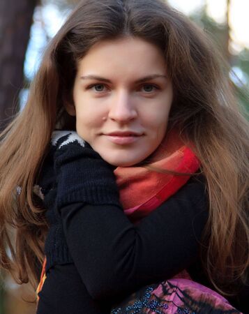 Portrait of young woman in autumn parkの写真素材