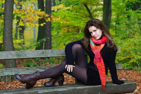 Portrait of young woman in autumn parkの写真素材