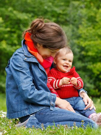 Mother with baby in the parkの写真素材