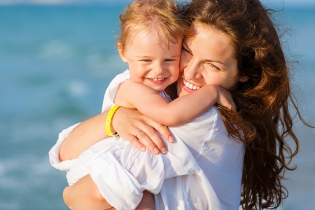 Mother and daughter on the beachの写真素材