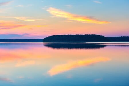 Beautiful tranquil sunset on a lakeの写真素材