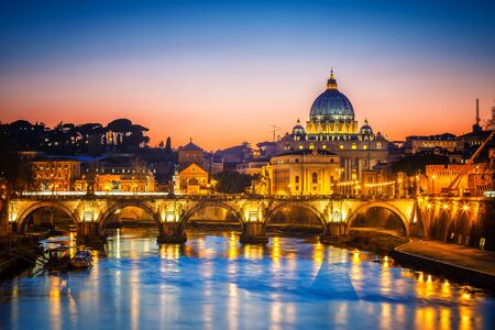 Night view of St. Peters cathedral and Tiber river in Rome, Italyの写真素材