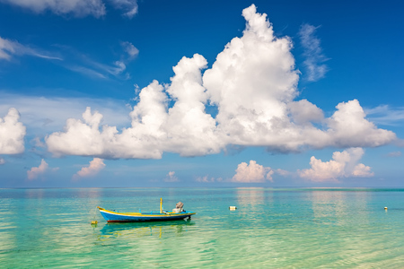 Beautiful ocean beach and boat on Maldivesの写真素材