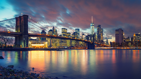 Brooklyn bridge and Manhattan after sunset, New York Cityの写真素材