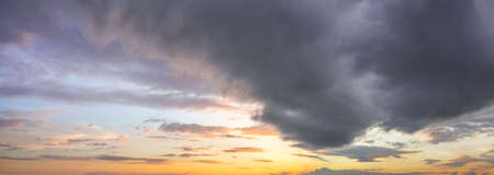 Natural background: dramatic stormy sky at sunset