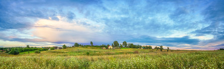 Panoramic view on rural landscape at summer eveningの写真素材