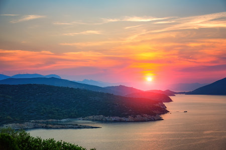 Colorful sunset over sea in Greeceの写真素材