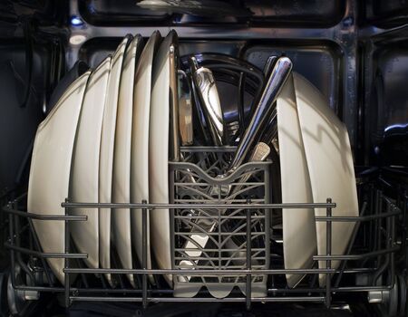 Interior of dishwasher and washed dishes.の写真素材
