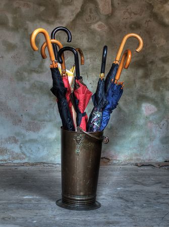 Copper rack for umbrellas in grunge style and HDR technique.の写真素材