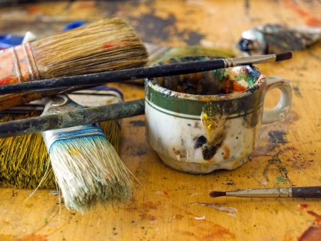 Closeup of  a  mess on the painter's table in some art studio.の写真素材