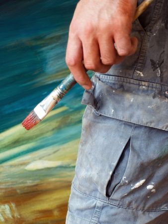 Closeup of the painter's creative moment of thinking during his  work..の写真素材