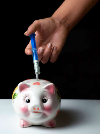 The metaphor about giving" injection" to our financial savings..の写真素材