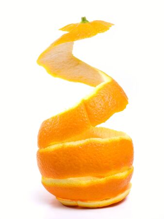 Spiral peeled bark of a ripe orange isolated on white background.の写真素材